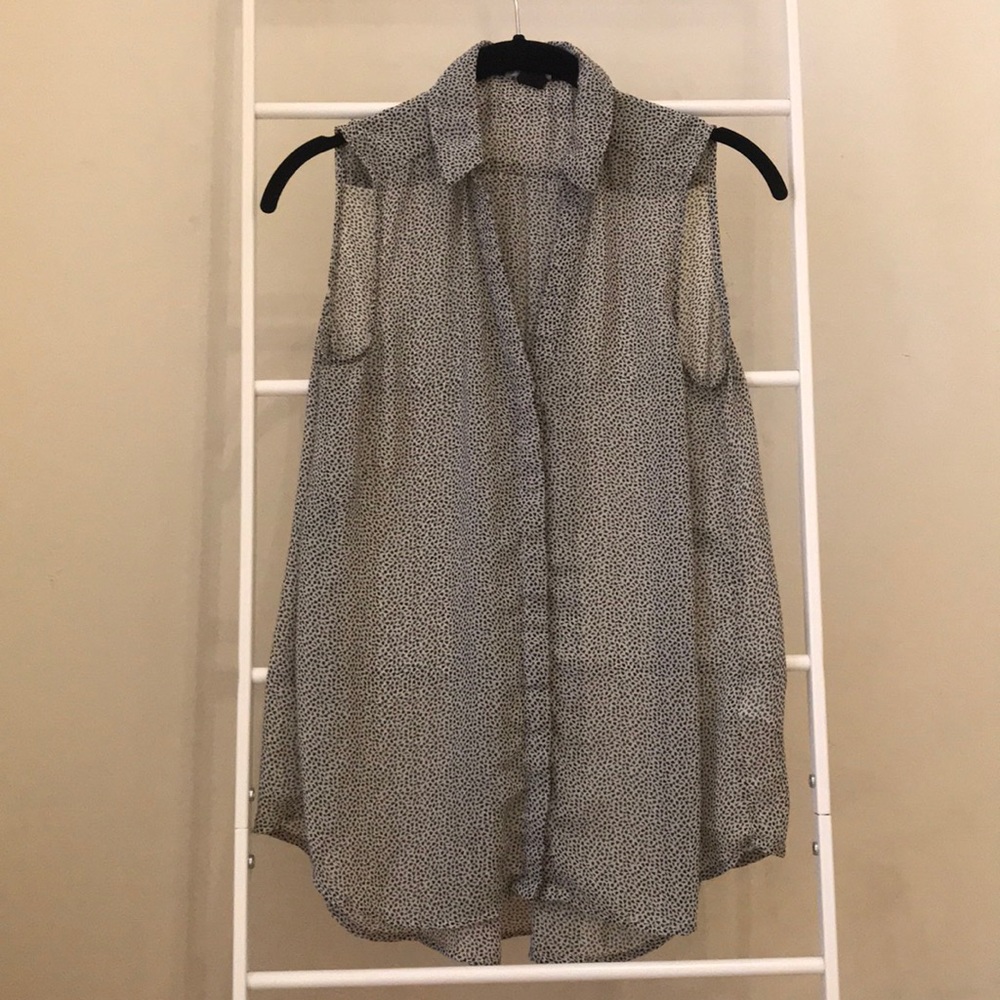 Sleeveless sheer black and white collared blouse